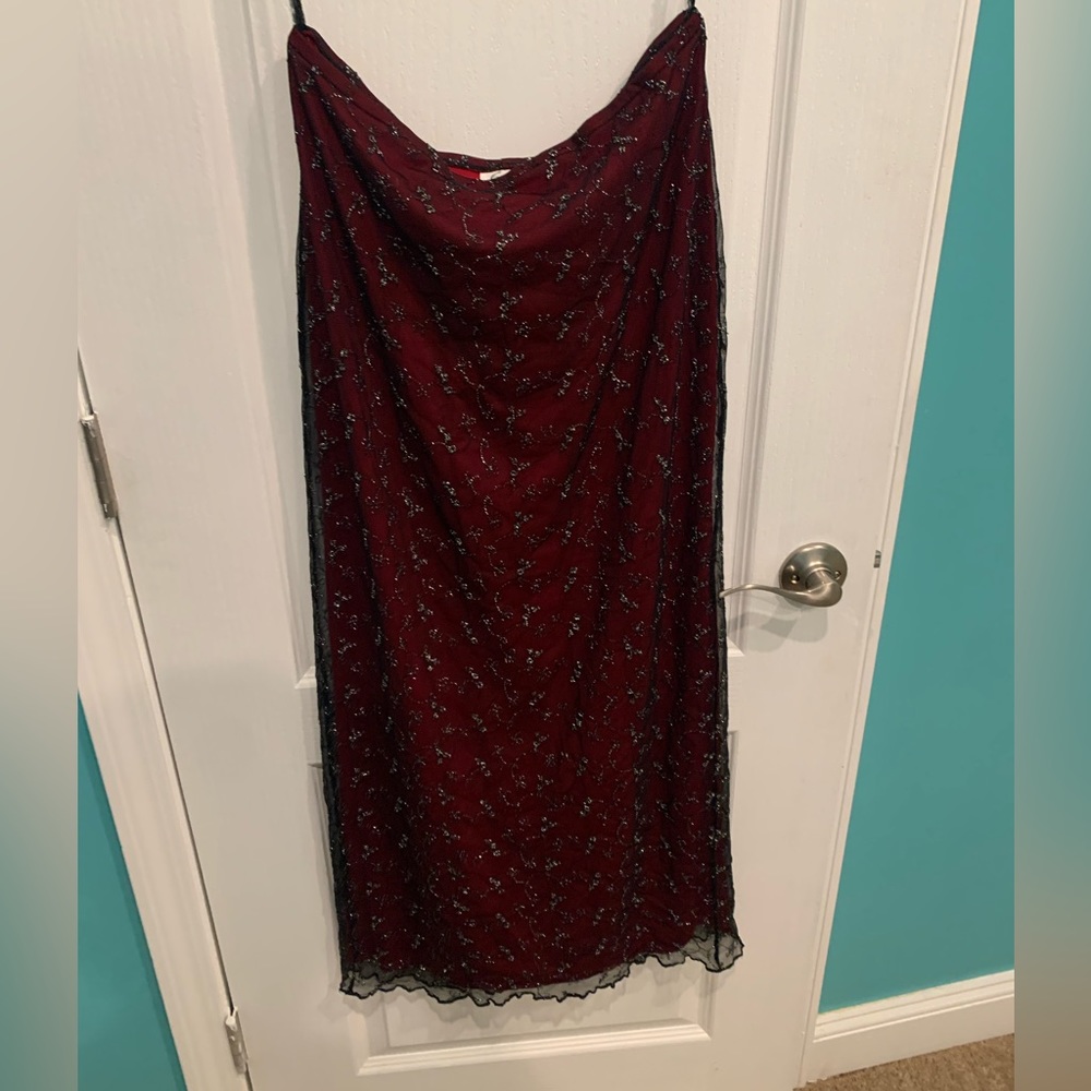 black sparkle lace over red skirt Lenght is apx 38”